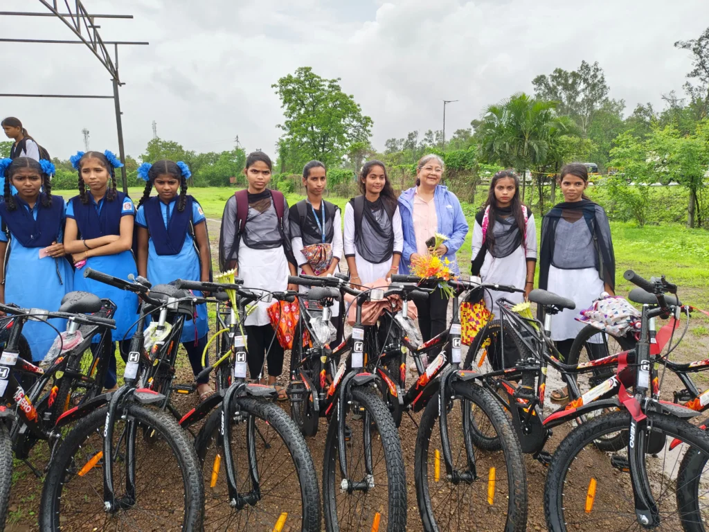 Geeta Muchhala with happy students at cycle distribution event