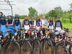 Geeta Muchhala with happy students at cycle distribution event